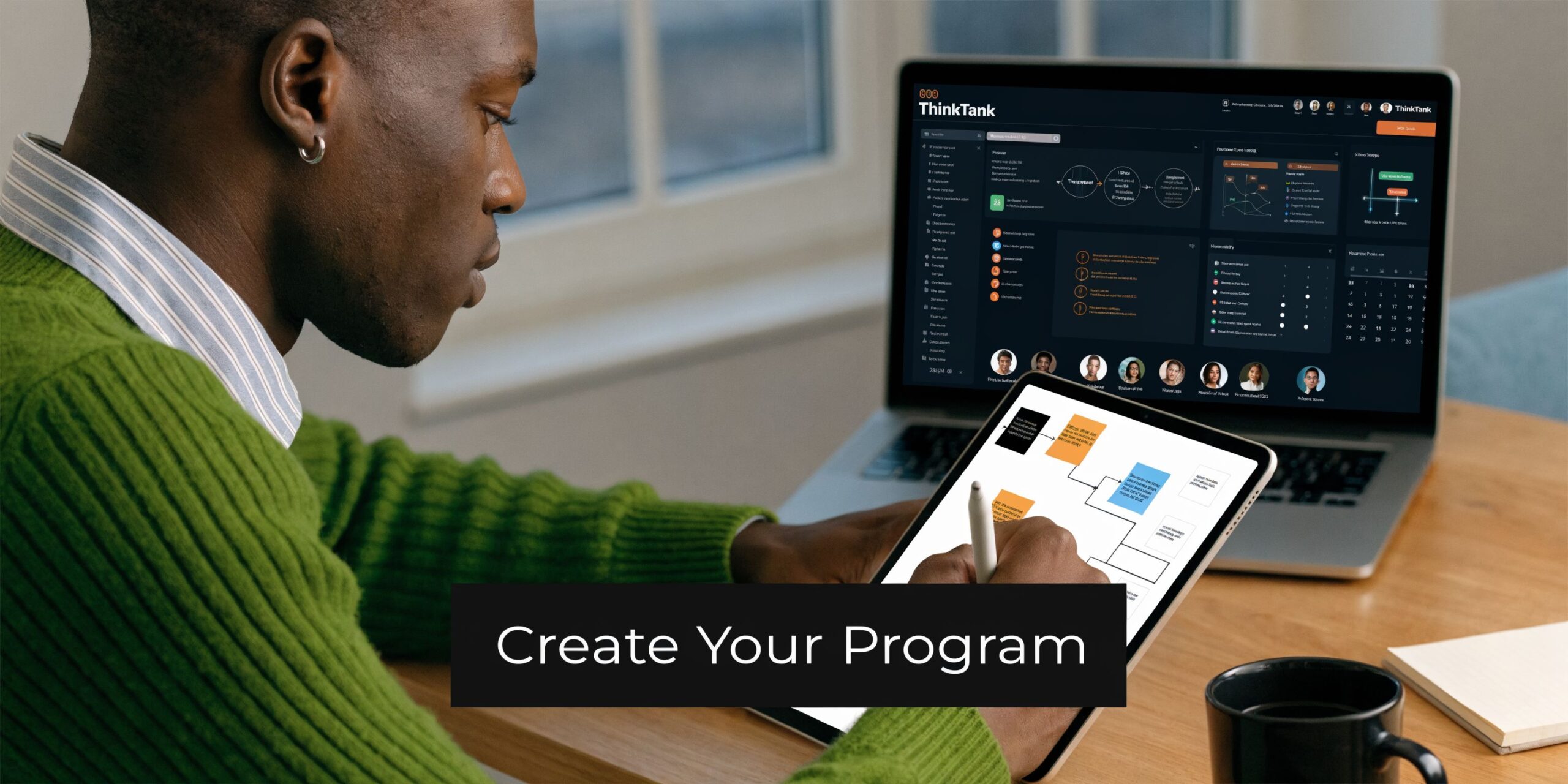 A professional man working on a laptop and tablet to create a structured health program.