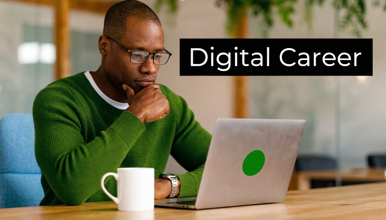 A professional man in a green sweater thinking while working on his laptop at a wooden desk.