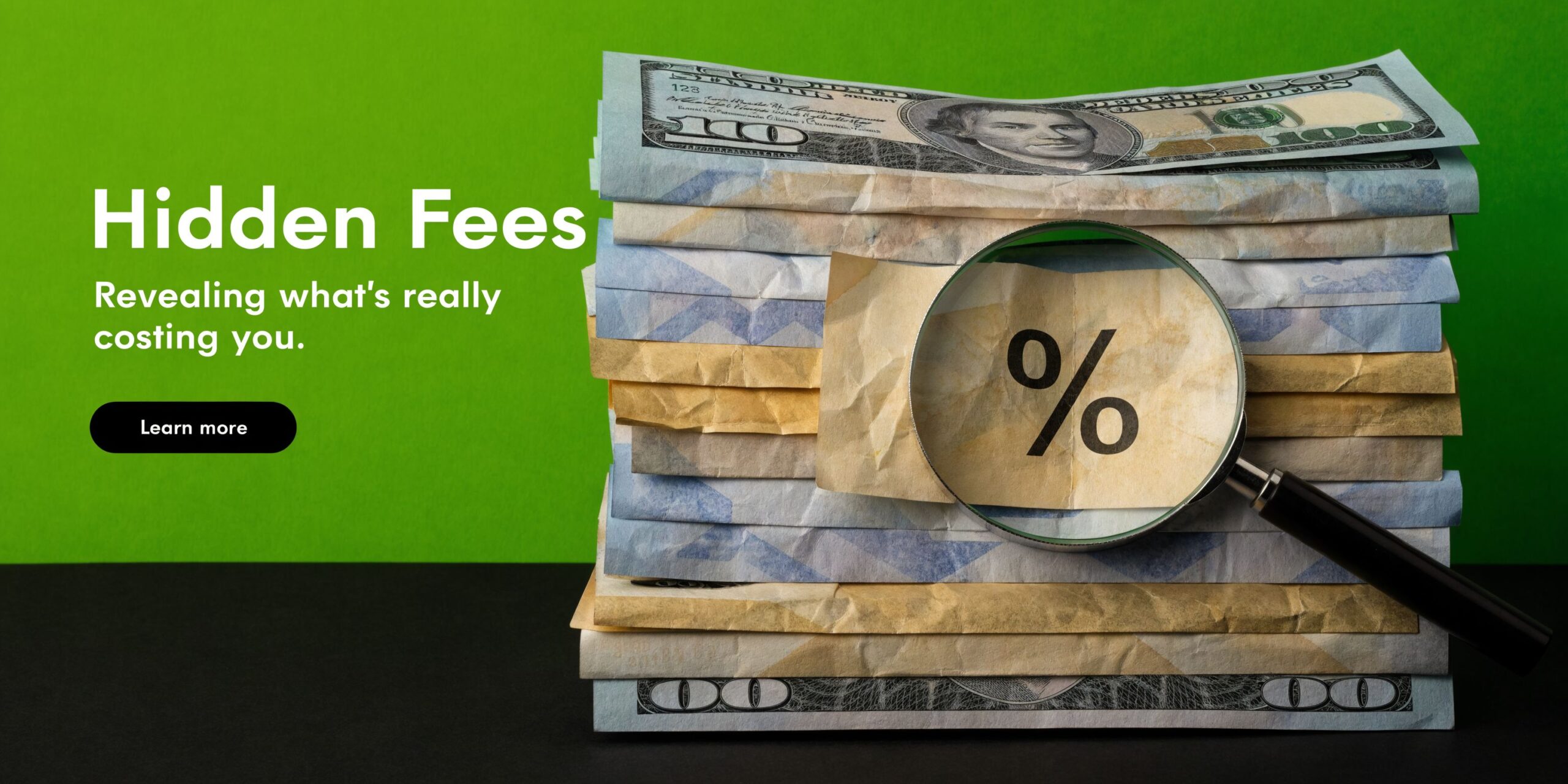 A stack of hundred dollar bills with a magnifying glass revealing a percent symbol, symbolizing hidden bank fees.
